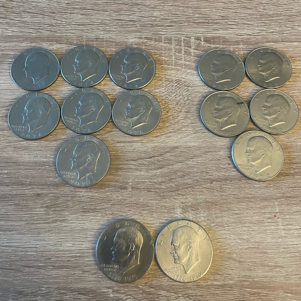 Lot of 14 Eisenhower Dollar silver dollar coins.